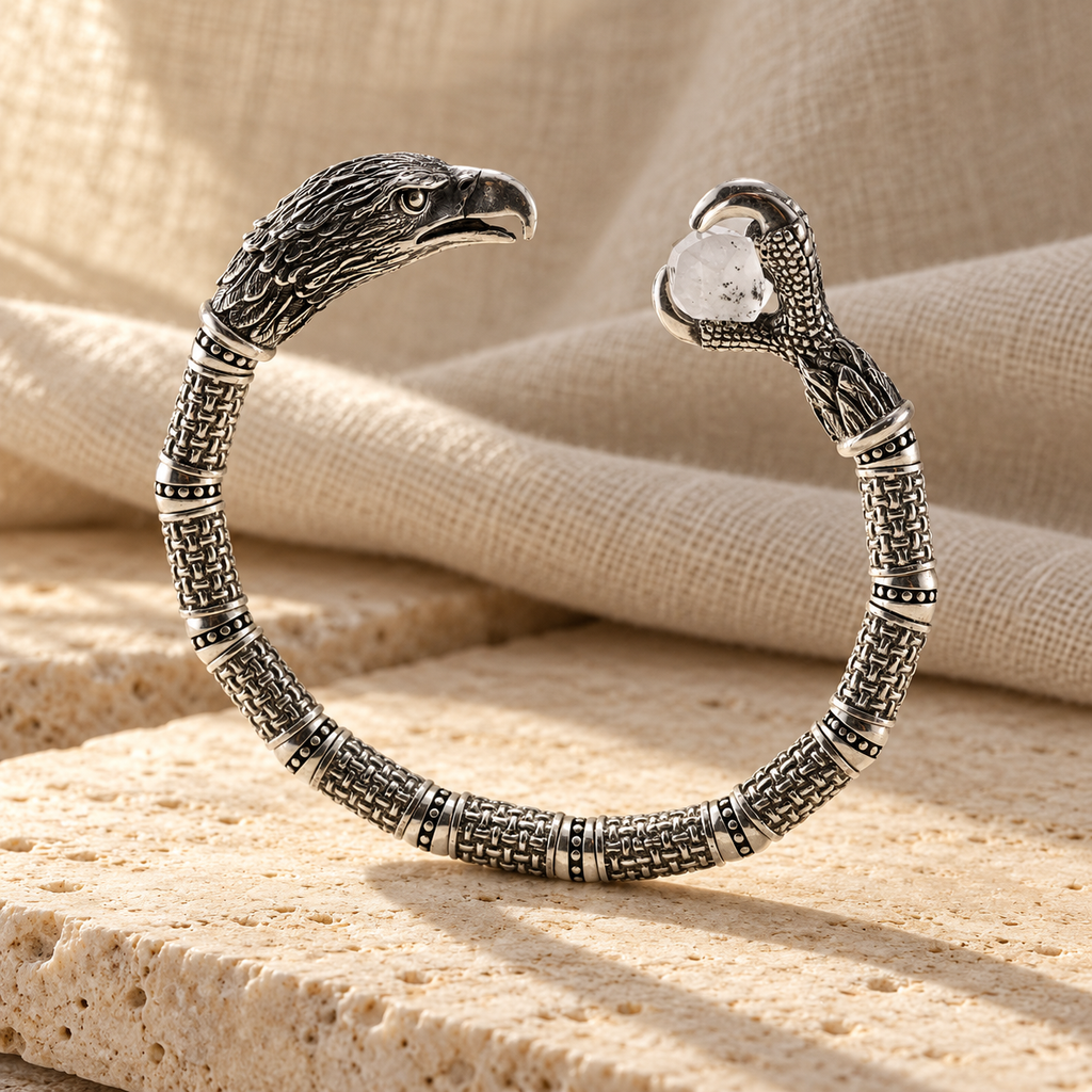 Silver eagle cuff on travertine and linen