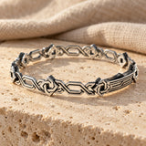 Armenian ornament bracelet in sterling silver on travertine stone