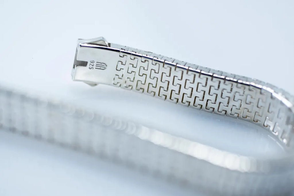 Close view of the woven silver link pattern and clasp