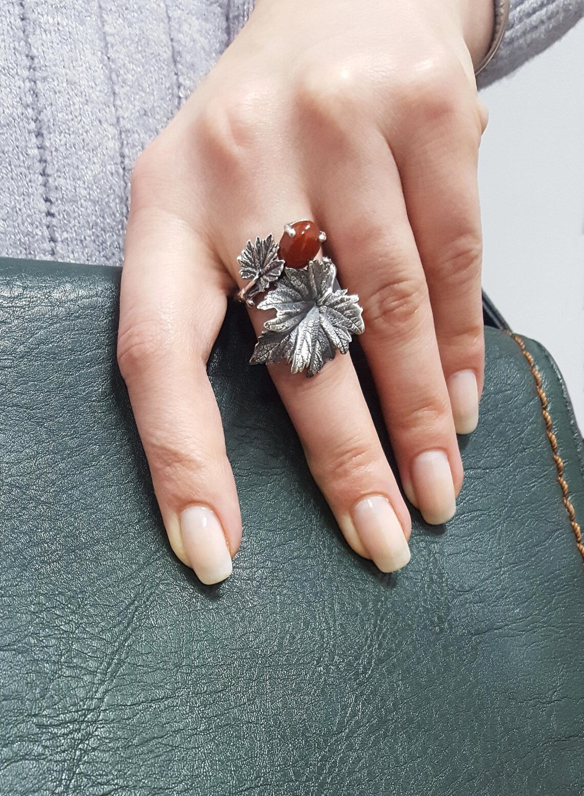 Vine leaf ring with red carnelian worn on the hand, 925 sterling silver