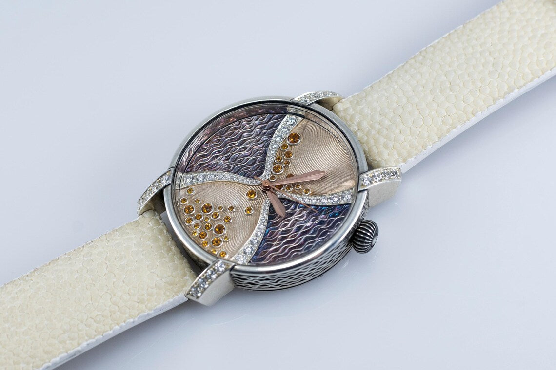 Guilloché watch dial with cubic zirconia, side view of the woven silver case