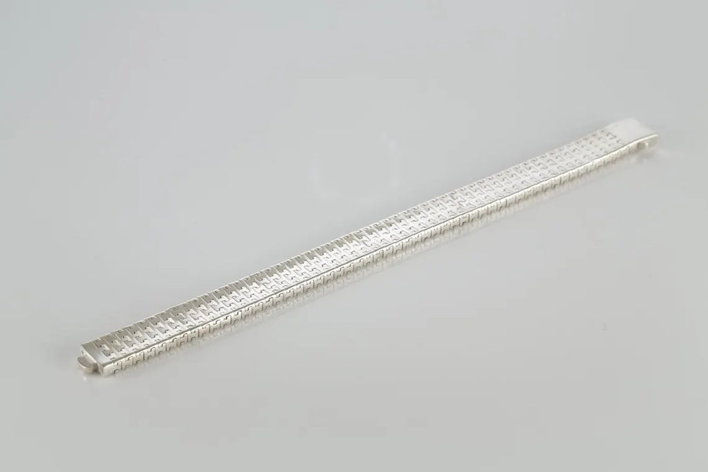 Rhodium-plated woven link bracelet laid straight