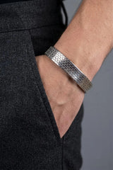 Woven link bracelet in rhodium-plated sterling silver worn on the wrist